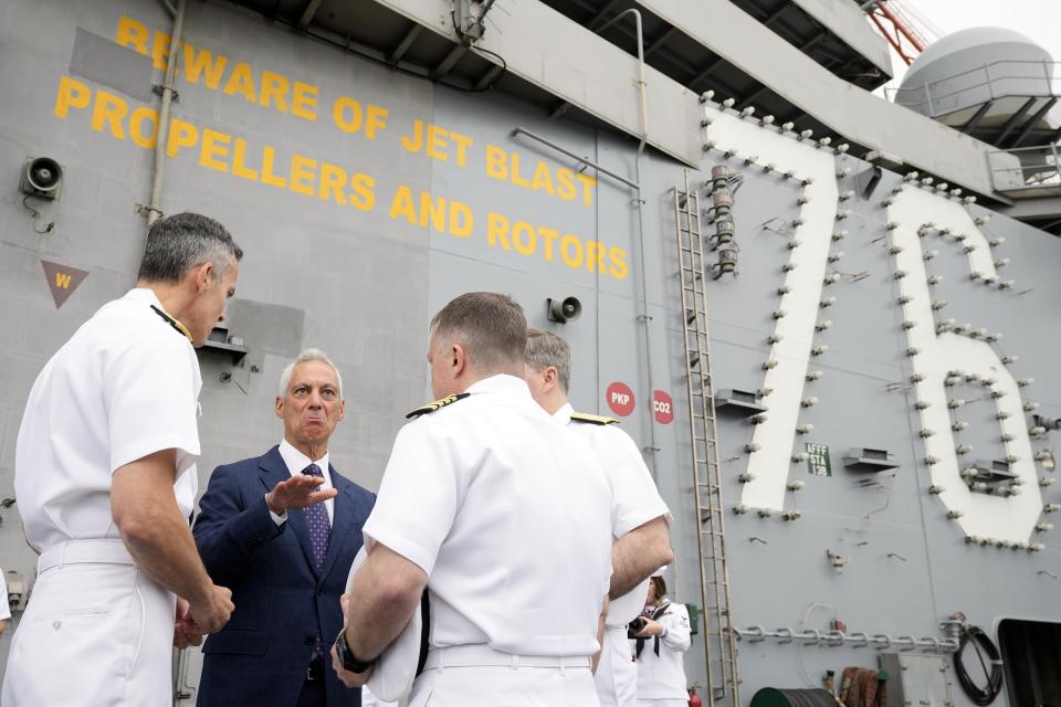 U.S. Ambassador to Japan Rahm Emanuel, center, speaks with officers at the U.S. navy aircraft carriers USS Ronald Reagan (CVN-76) before its voyage at the U.S. navy's Yokosuka base Thursday, May 16, 2024, in Yokosuka, south of Tokyo. This is the ship's final departure from Yokosuka before transiting back to the United States. (AP Photo/Eugene Hoshiko)