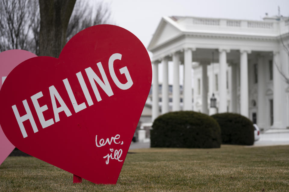 A Valentine's Day decoration, signed by first lady Jill Biden, sits on the North Lawn of the White House, Friday, Feb. 12, 2021, in Washington. (AP Photo/Evan Vucci)