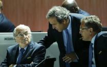 UEFA President Michel Platini (C) speaks with FIFA President Sepp Blatter (L) and Jerome Valcke, Secretary General of the FIFA, at the 65th FIFA Congress in Zurich, Switzerland, May 29, 2015. REUTERS/Ruben Sprich