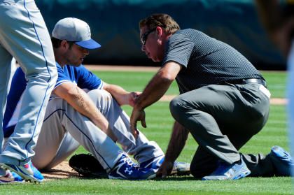 Clayton Kershaw (22) is examined after being hit by a line drive in the third inning. (USA TODAY Sports)