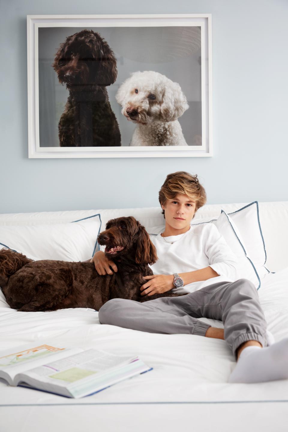 Macpherson’s son Cy lounges with the family dog.