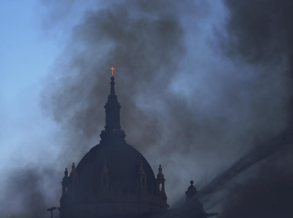 Firefighters battle a fire in downtown St. Paul, Minn., that has engulfed a building that was under construction on Tuesday, Aug. 4, 2020. There were no reports of injuries and there was no immediate word about the possible cause of the fire. (David Joles /Star Tribune via AP)