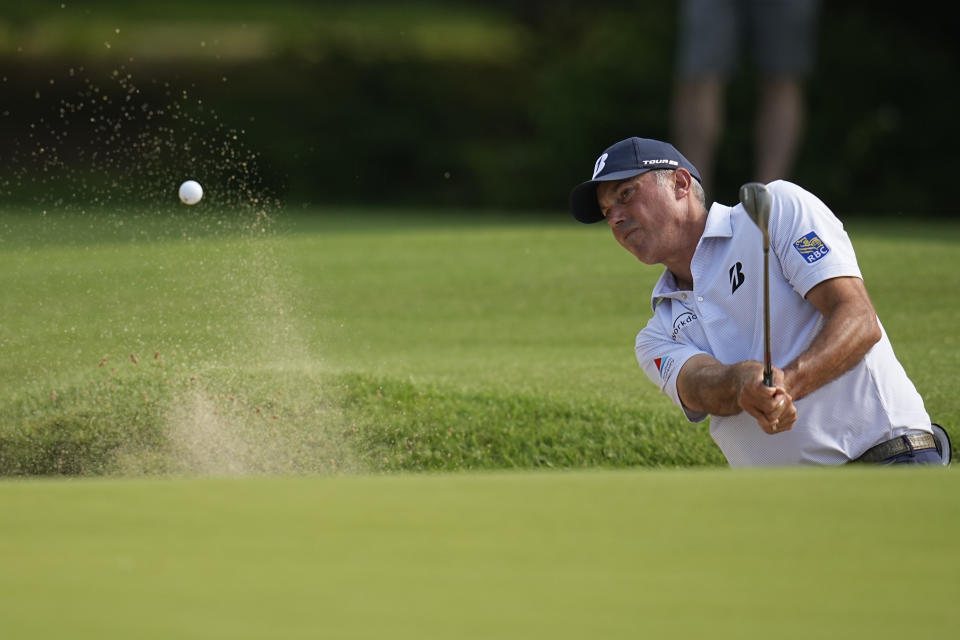 Matt Kuchar hits from the bunker on the seventh hole during the first round of the PGA Championship golf tournament, Thursday, May 19, 2022, in Tulsa, Okla. (AP Photo/Sue Ogrocki)