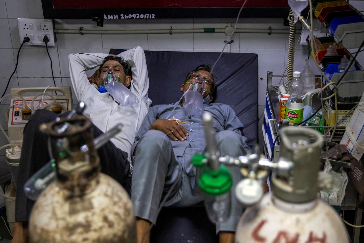 Patients suffering from COVID-19 receive treatment in the casualty ward of a New Delhi hospital on April 15, 2021.