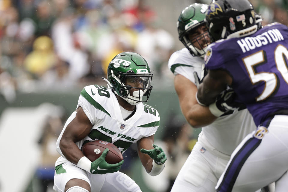 New York Jets running back Breece Hall (20) rushes during the first half of an NFL football game against the Baltimore Ravens, Sunday, Sept. 11, 2022, in East Rutherford, N.J. (AP Photo/Adam Hunger)