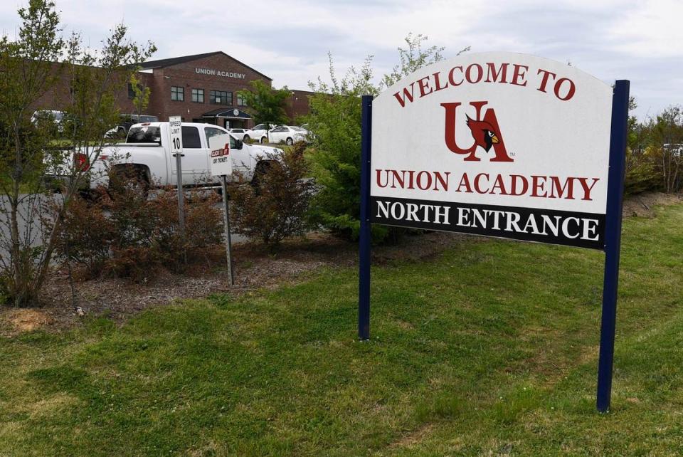 A truck proceeds up the driveway of Union Academy Charter School in Monroe, NC, on Wednesday, April 14, 2021. Barney Dale Harris, a teacher and coach at the school, was killed in a shootout involving a drug cartel in North Carolina the previous week.