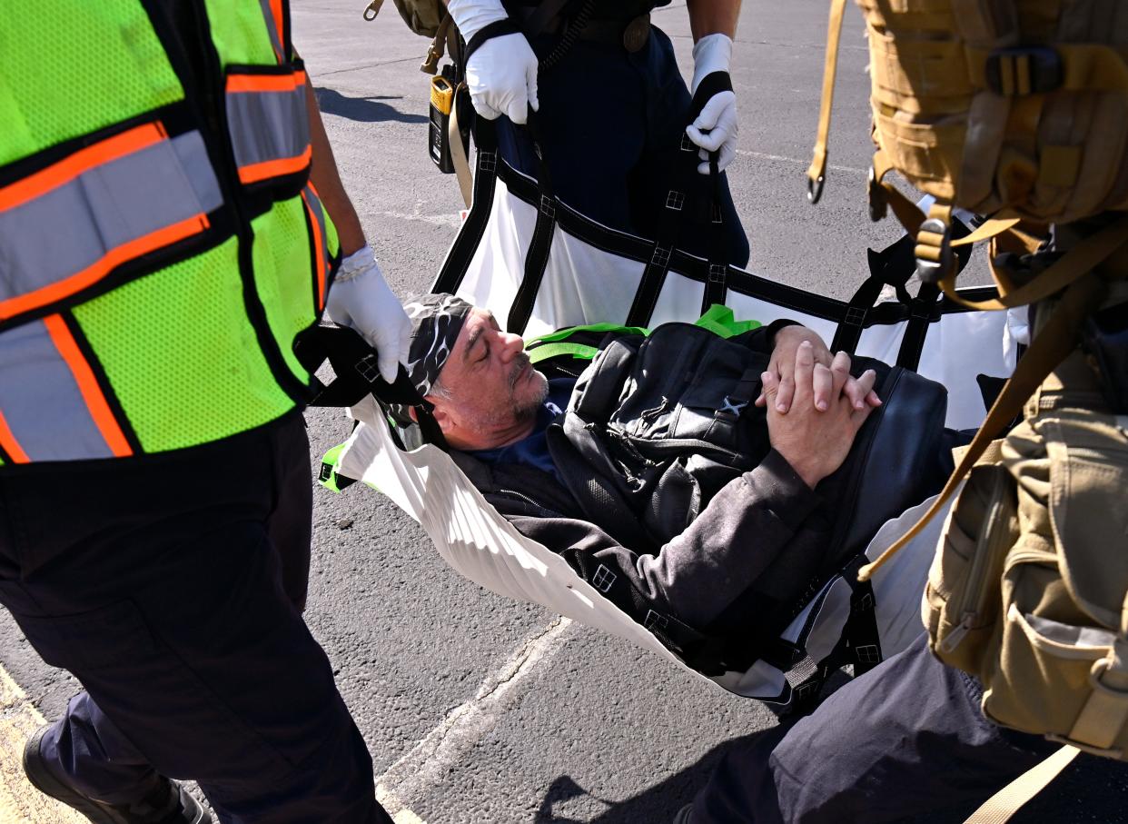 Jake Ryan relaxes as first responders carry him toward an ambulance during the Abilene Regional Airport emergency exercise Wednesday.