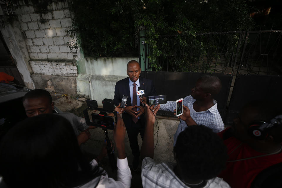Senator Nenel Cassy speaks to journalists after a press conference to announce plans for a massive protest march to the United Nations headquarters the following day, in Port-au-Prince, Haiti, Thursday, Oct. 3, 2019. As the public appearances of President Jovenel Moise fade with Haiti's deepening political turmoil, dozens of people from political parties old and new are vying to become the country's next leader as they seize on widespread discontent.(AP Photo/Rebecca Blackwell)