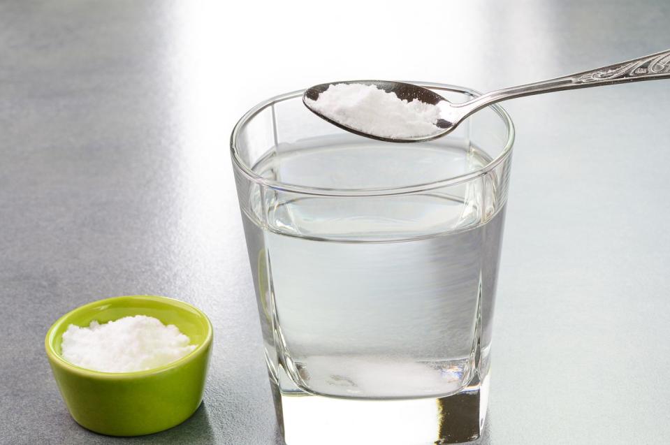 baking soda over a glass of liquid