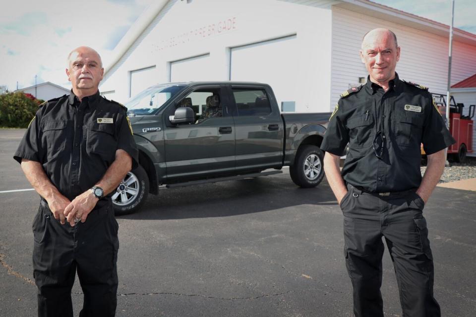 Onslow Fire chief Greg Muise and deputy chief Darrell Currie, pictured in the fall of 2020, were inside their fire hall when two RCMP officers started firing outside.