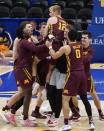 Minnesota's Luke Loewe (12) is hoisted by teammates after Minnesota defeated Pittsburgh 54-53 in an NCAA college basketball game, Tuesday, Nov. 30, 2021, in Pittsburgh. Loewe scored the go-ahead basket in the closing seconds. (AP Photo/Keith Srakocic)