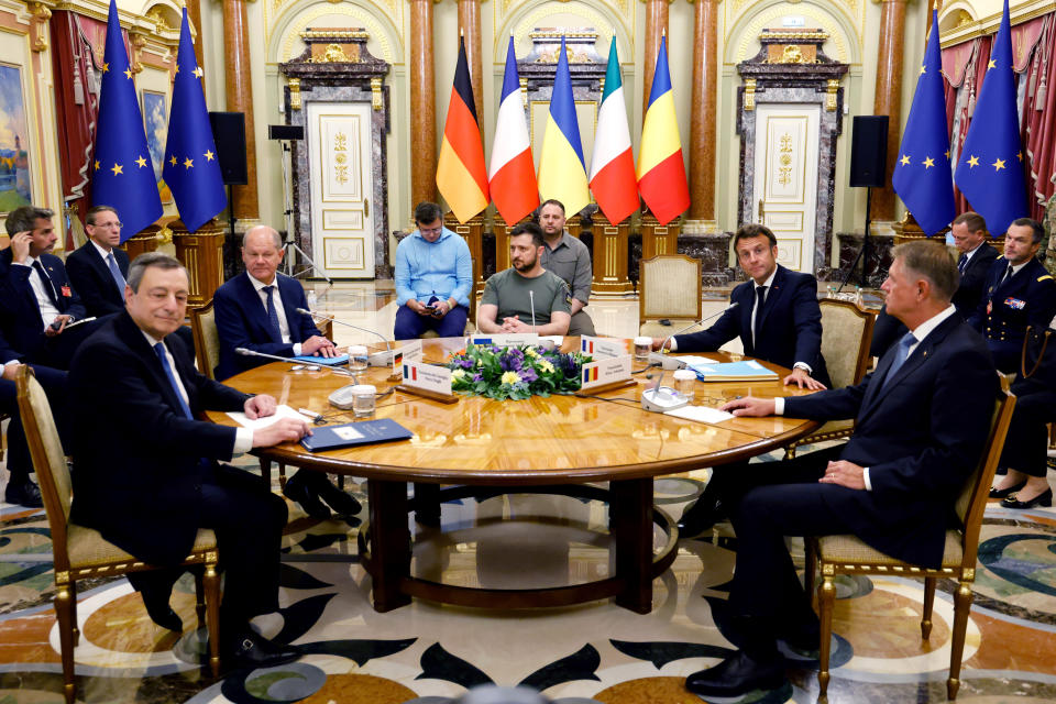 FILE - Italian Prime Minister Mario Draghi, left, German Chancellor Olaf Scholz, second left, Ukrainian President Volodymyr Zelenskyy, center, French President Emmanuel Macron second right, and Romanian President Klaus Iohannis meet for a working session in Mariinsky Palace, in Kyiv, Thursday, June 16, 2022. (Ludovic Marin, Pool via AP, File)