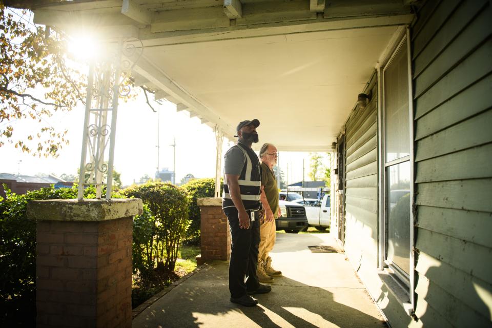 Code enforcement officer Dereke Planter Jr., left, goes over a home on Murchison Road with contractor Bob Rogers to point out anything that needs to be done to the home to bring it up to code, Wednesday, Oct. 4, 2023.