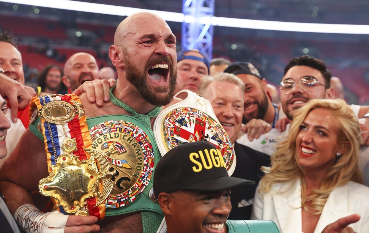 Tyson Fury celebrates victory after the WBC World Heavyweight Title Fight between Tyson Fury and Dillian Whyte at Wembley Stadium on April 23, 2022 in London, England.