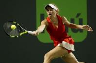 Mar 28, 2017; Miami, FL, USA; Caroline Wozniacki of Denmark hits a forehand against Lucie Safarova of the Czech Republic (not pictured) on day eight of the 2017 Miami Open at Crandon Park Tennis Center. Mandatory Credit: Geoff Burke-USA TODAY Sports