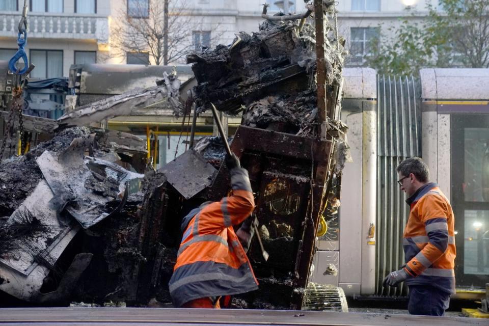 A burned-out bus is removed from O’Connell Street in Dublin, in the aftermath of violent scenes in the city centre on Thursday (PA Wire)