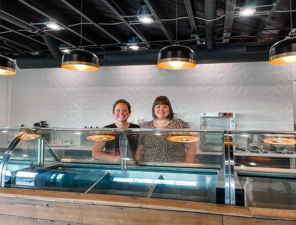 Sisters Staci Meyer and Lauri Gingerich behind the custom-built counter at The Sugar Queen Creamery on June 8. The new creamery will open on June 20 and serve up to 28 flavors of house made ice cream.