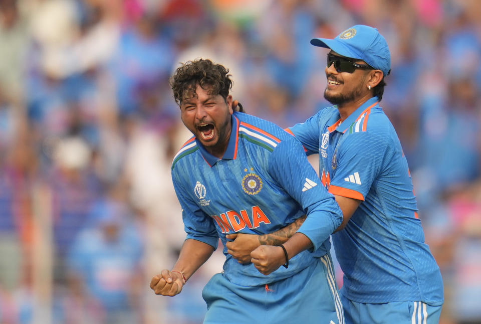 India's Kuldeep Yadav celebrates the wicket of Pakistan's Saud Shakeel during the ICC Men's Cricket World Cup match between India and Pakistan in Ahmedabad, India, Saturday, Oct. 14, 2023. (AP Photo/Aijaz Rahi)