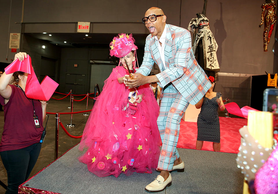 <p>RuPaul cut the ribbon for the opening of the first RuPaul’s DragCon NYC, an all-ages, family-friendly celebration of drag culture, alongside 10-year-old Desmond is Amazing, one of the two-day event’s many featured guests. (Photo: World of Wonder) </p>