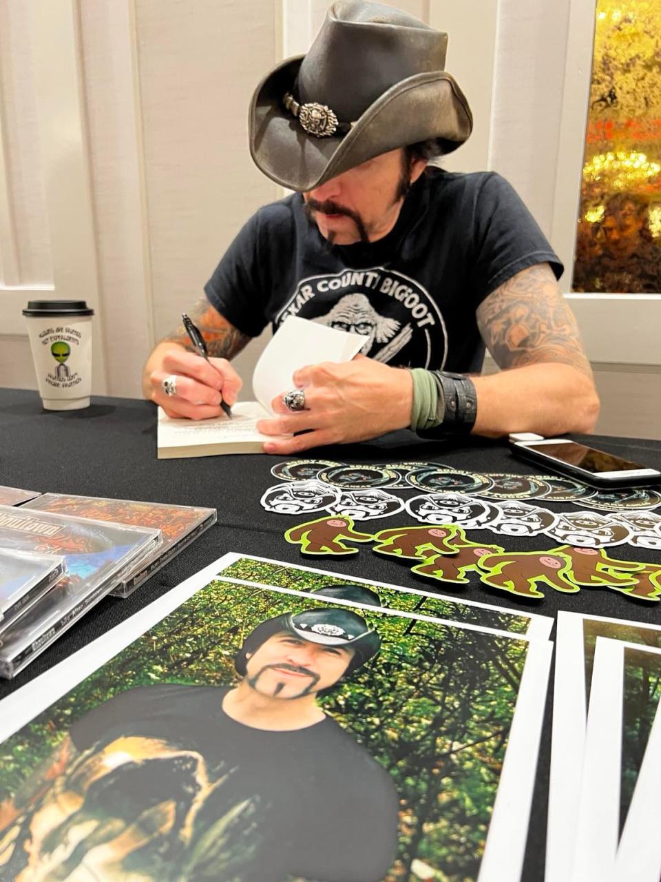 Author Lyle Blackburn signs a book at last year's inaugural Monster Fest at the DoubleTree by Hilton hotel in downtown Canton. The event returns on June 29.