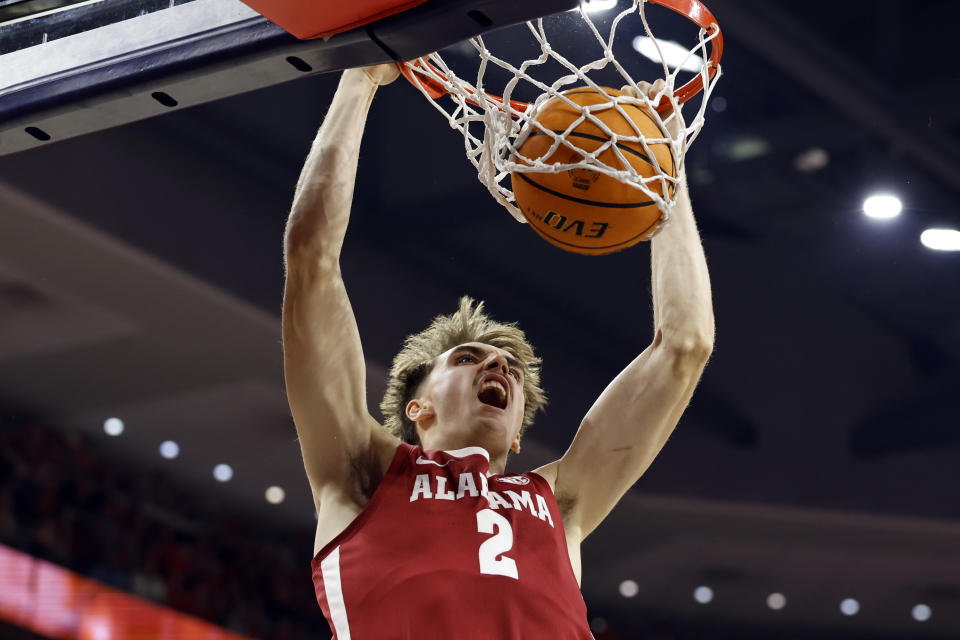 Alabama forward Grant Nelson slam dunks the ball during the first half of an NCAA college basketball game against Auburn, Wednesday, Feb. 7, 2024, in Auburn, Ala. (AP Photo/Butch Dill)