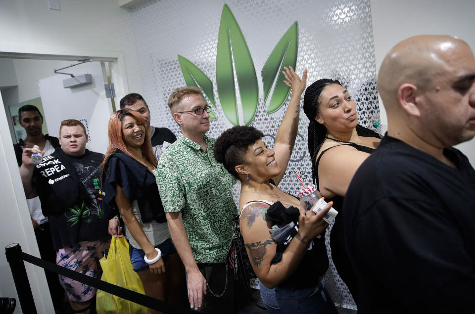 <p>People wait in line at the Essence cannabis dispensary, Saturday, July 1, 2017, in Las Vegas. Nevada dispensaries were legally allowed to sell recreational marijuana starting at 12:01 a.m. Saturday. (Photo: John Locher/AP) </p>