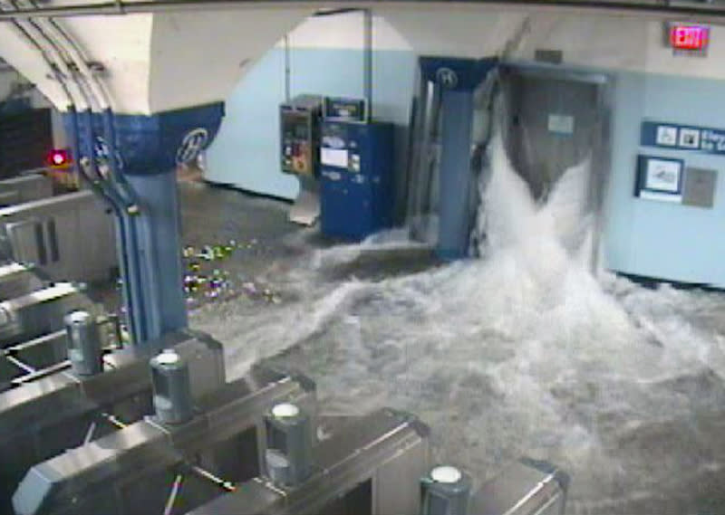 In this photo provided by the Port Authority of New York and New Jersey a surveillance camera captures the PATH station in Hoboken, N.J., as it is flooded shortly before 9:30 p.m. EDT on Monday, Oct. 29, 2012. Sandy continued on its path Monday, as the storm forced the shutdown of mass transit, schools and financial markets, sending coastal residents fleeing, and threatening a dangerous mix of high winds and soaking rain. (AP Photo/Port Authority of New York and New Jersey)