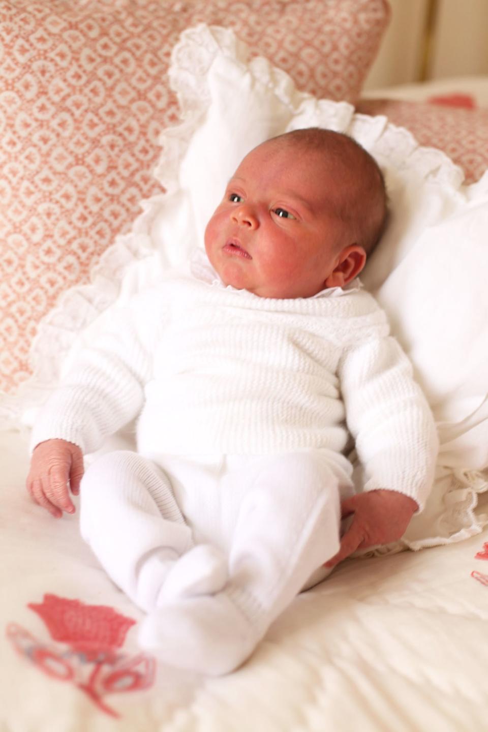 Taken in their London home at Kensington Palace, Kate gave the world their <a rel="nofollow noopener" href="https://people.com/royals/prince-louis-princess-charlotte-first-official-photos/" target="_blank" data-ylk="slk:first close-up glimpse;elm:context_link;itc:0;sec:content-canvas" class="link ">first close-up glimpse</a> at the newest member of the royal family. 
