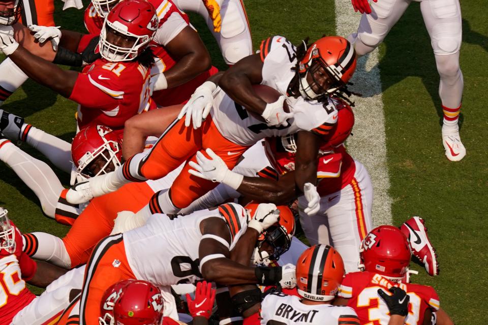 Cleveland Browns running back Kareem Hunt (27) scores a 2-point conversion during the first half of an NFL football game against the Kansas City Chiefs Sunday, Sept. 12, 2021, in Kansas City, Mo. (AP Photo/Charlie Riedel)