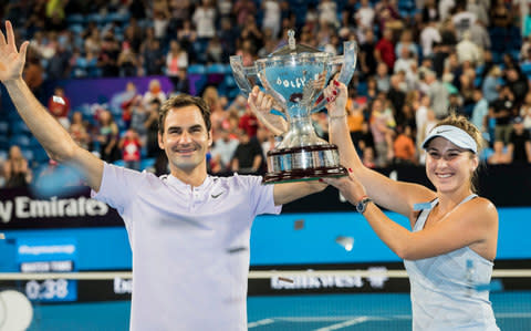 Roger Federer and Belinda Bencic of Switzerland celebrate winning the final at the Hopman Cup tennis tournament in Perth, Australia, Saturday, Jan. 6, 2018 - Credit: AP