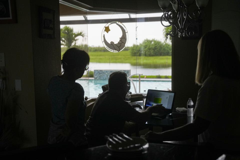 The land behind the home of John Erario and Sue Caglioti at the Royal Palm Golf Estates in Naples is visible on Thursday, Aug. 31, 2023. After promising not to build on the land, new plans could allow developers to go back on that agreement.