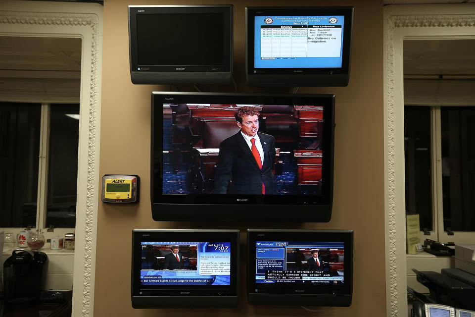 WASHINGTON, DC - MARCH 06:  U.S. Sen. Rand Paul (R-KY) is seen on TV monitors as he participates in a filibuster on the Senate floor March 6, 2013 on Capitol Hill in Washington, DC. Sen. Paul was filibustering the Senate to oppose the nomination of John Brennan to be the next director of CIA.  (Photo by Alex Wong/Getty Images)