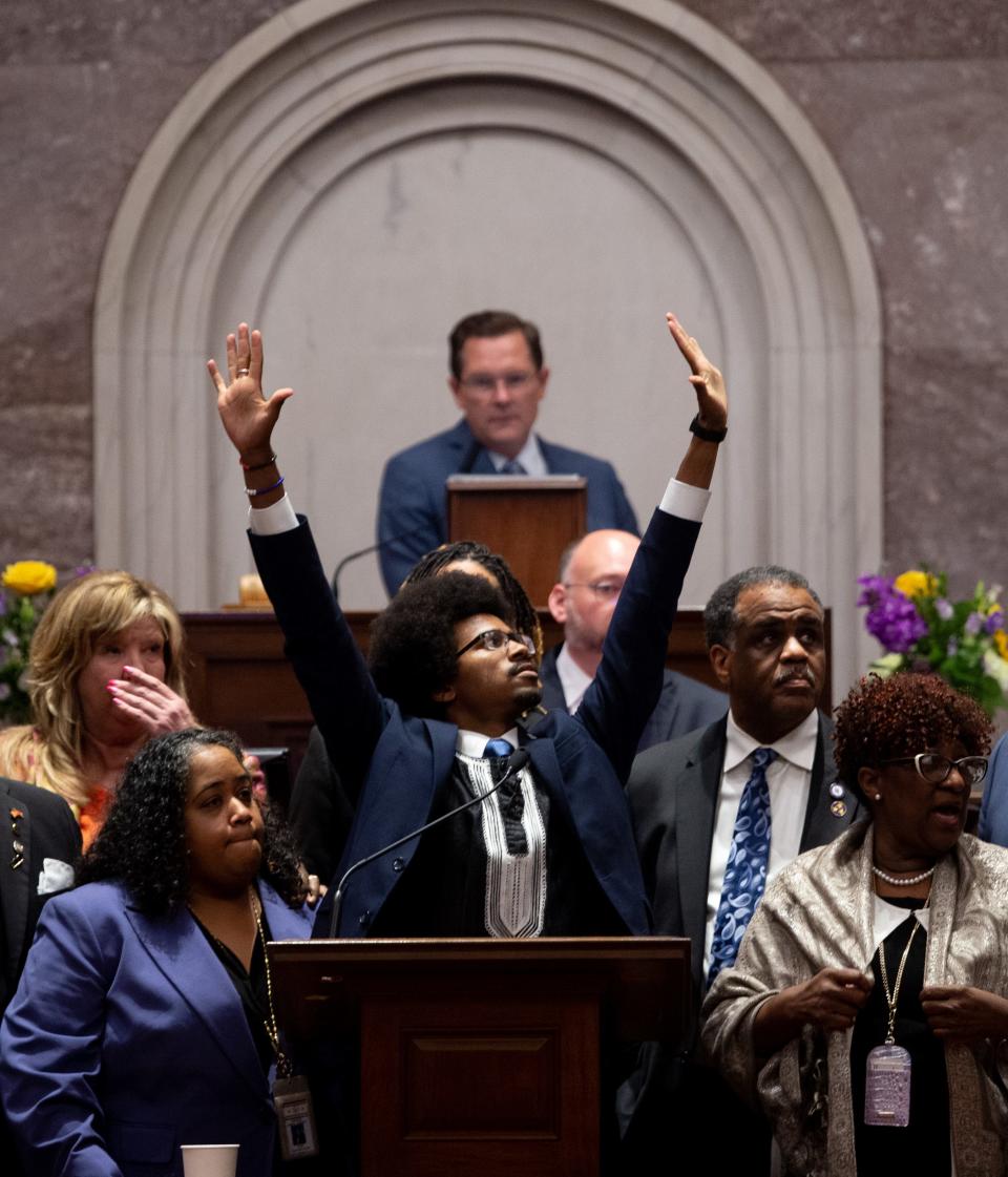 Justin Pearson, D-Memphis, holds his hands in the air during a vote to expel him from the House of Representatives at the Tennessee State Capitol in Nashville, Tenn., on Thursday, April 6, 2023. House Speaker Cameron Sexton appears behind him.