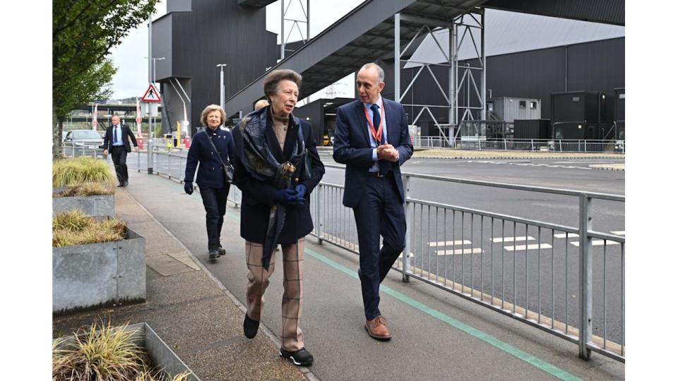 Princess Anne walking outside with a man