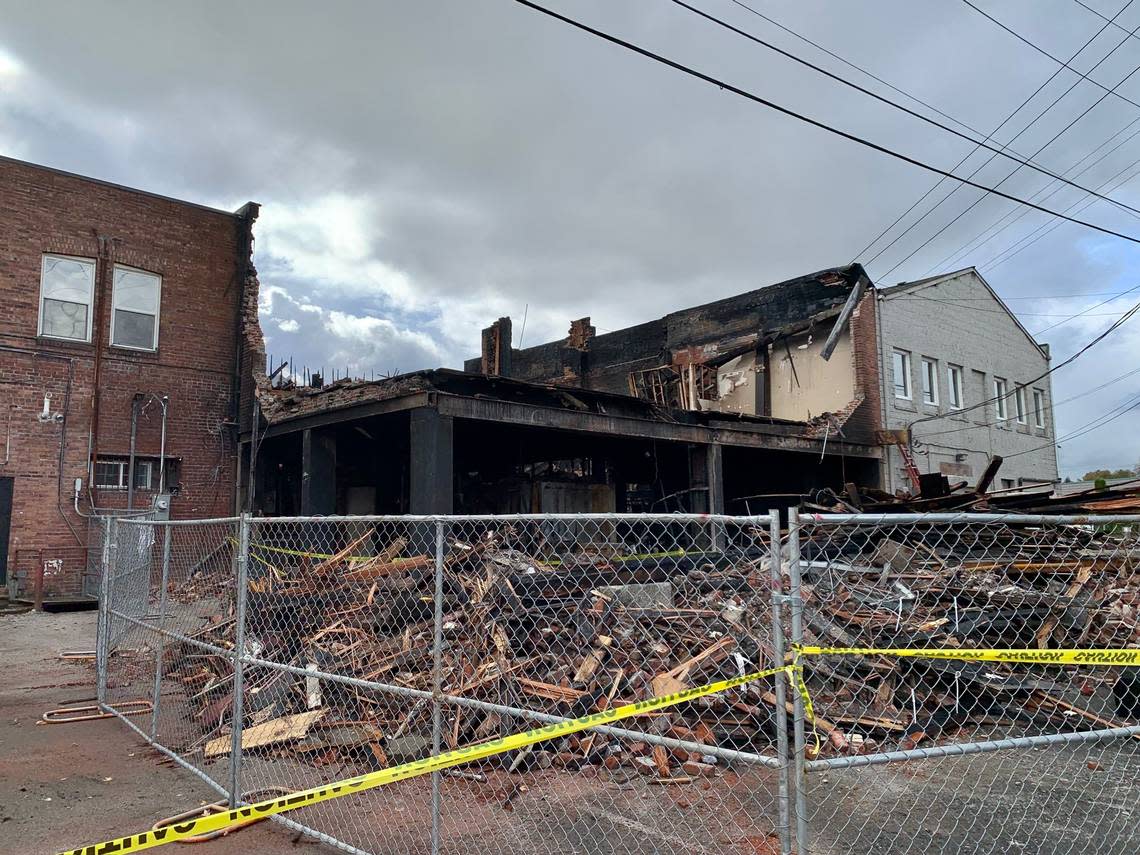 The back of what remains of 1003-1005 Main St. in Sumner, Wash., following the Oct. 28 three-alarm fire, shown here on Wednesday, Nov. 2, 2022 after crews had knocked down unsafe parts of the 111-year-old building.