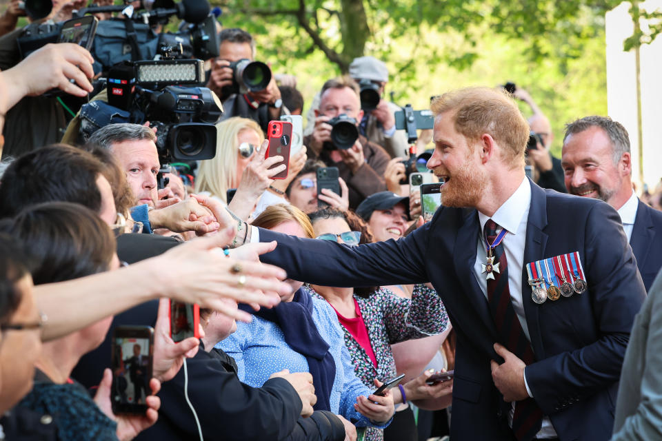 Prince Harry, The Duke of Sussex greets the public while departing The Invictus Games Foundation 10th Anniversary Service at St Paul's Cathedral on May 08, 2024 in London, England.
