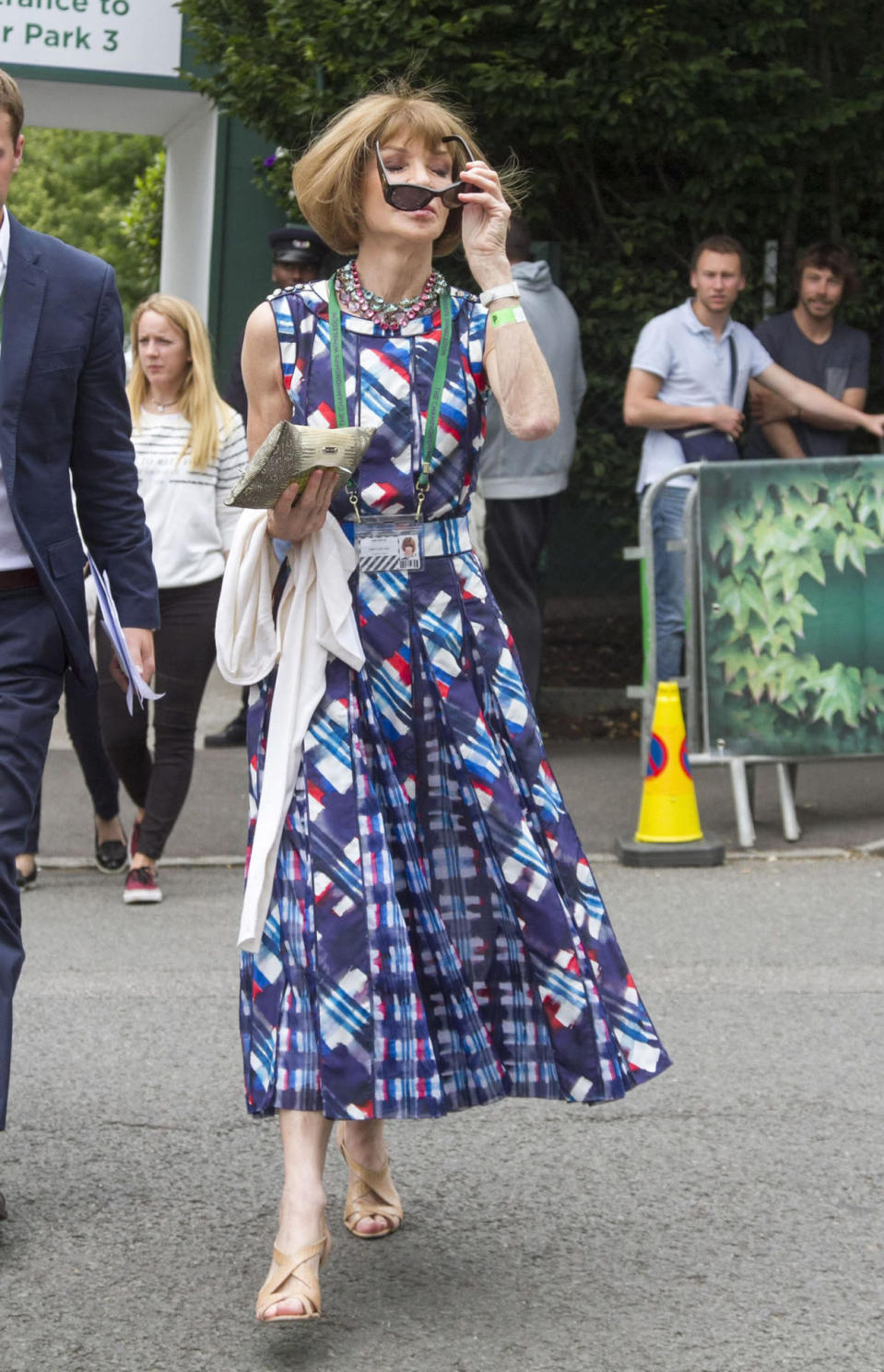 <p>The Vogue US editor-in-chief turned up at Wimbledon looked as glam as ever in a printed midi dress, statement necklace and, naturally, sunglasses. <i>[Photo: Rex]</i></p>