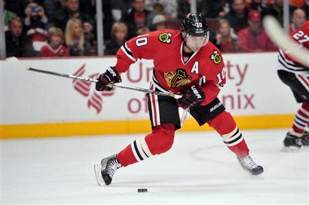 Dec 11, 2013; Chicago, IL, USA; Chicago Blackhawks left wing Patrick Sharp (10) shoots against the Philadelphia Flyers during the second period at the United Center. Rob Grabowski-USA TODAY Sports