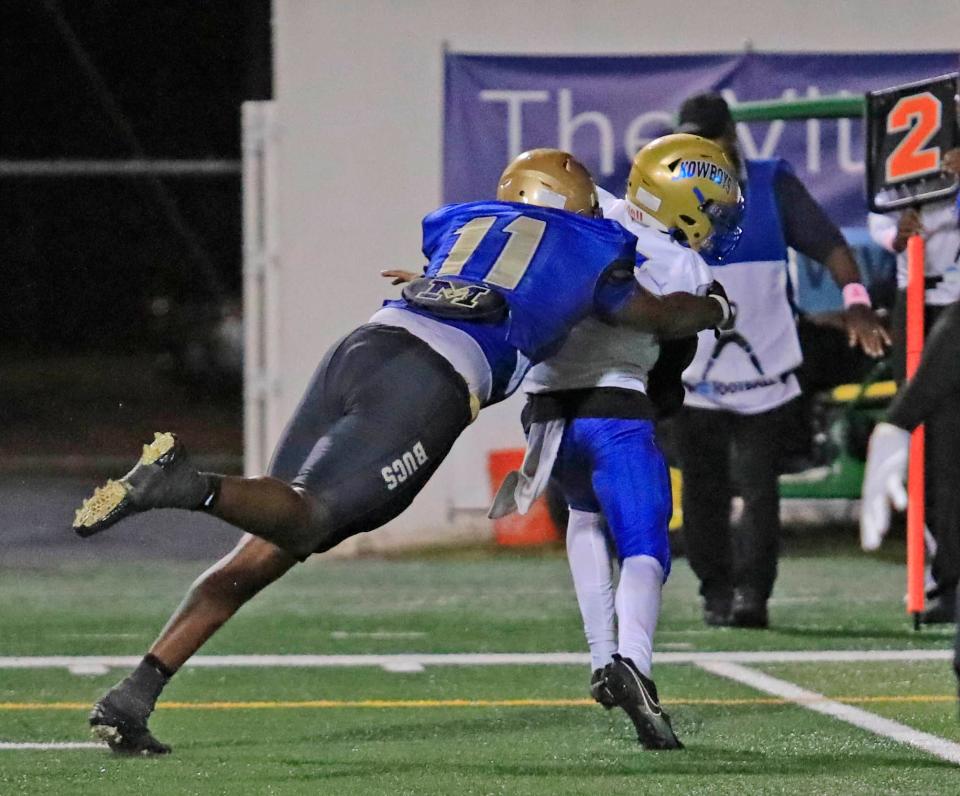 Mainland's LJ McCray (11) makes a tackle during Thursday night's game against Osceola on Oct.19th, 2023 at the Daytona Stadium.