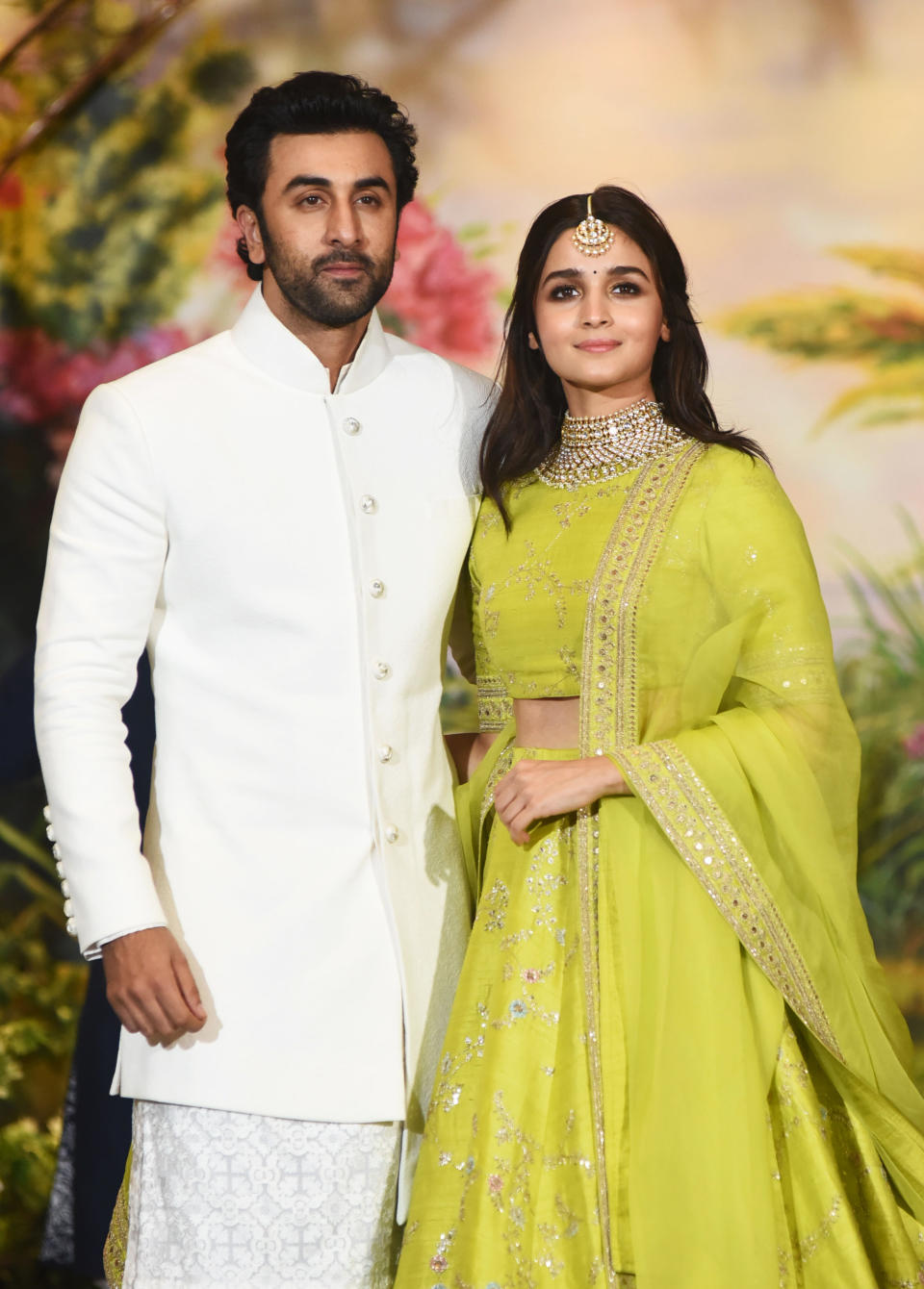 Indian Bollywood actors Ranbir Kapoor (L) and Alia Bhatt pose for a picture during the wedding reception of actress Sonam Kapoor and businessman Anand Ahuja in Mumbai late on May 8, 2018. (Photo by Sujit Jaiswal / AFP)        (Photo credit should read SUJIT JAISWAL/AFP via Getty Images)