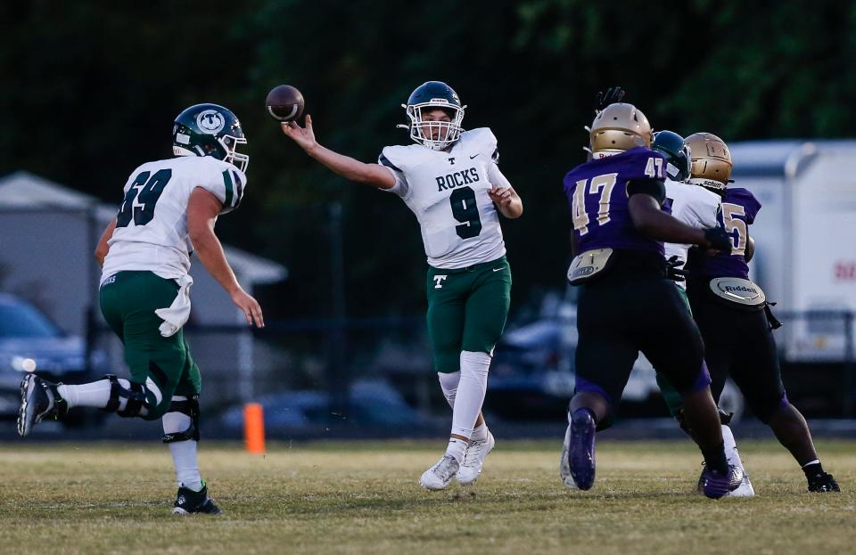 Trinity's Zane Johnson attempts a pass in the first half against Male. Sept. 15, 2023