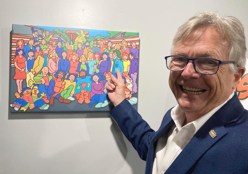 Tom New, 67, president and CEO of WQLN PBS NPR, identifies himself in an illustration of the staff he created. He got his start at WQLN as a graphic artist in 1998 and is retiring in 2023.