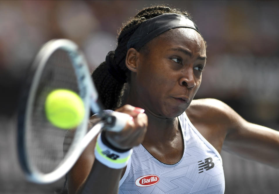 Coco Gauff of the U.S. makes a forehand return to compatriot Sofia Kenin during their fourth round singles match at the Australian Open tennis championship in Melbourne, Australia, Sunday, Jan. 26, 2020. (AP Photo/Andy Brownbill)