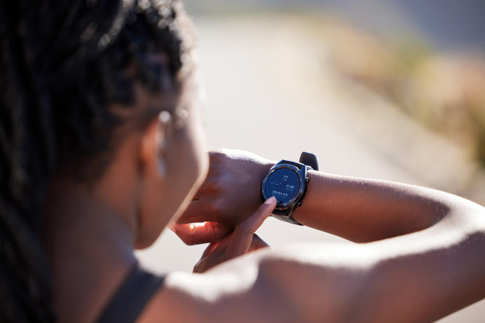 Woman with fitness watch. (Getty Images)