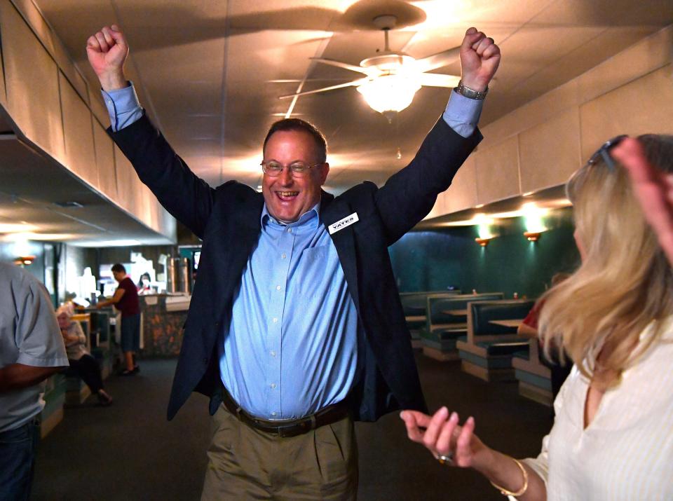 Brian Yates celebrates his victory over Scott Beard for the Abilene City Council Place 4 seat Saturday.