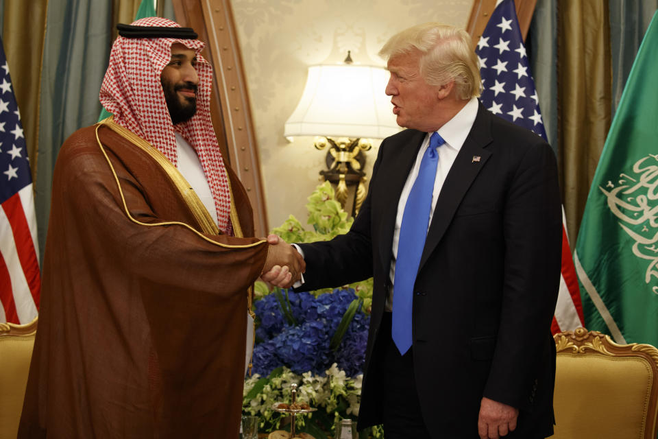 FILE- In this Saturday, May 20, 2017 file photo, President Donald Trump shakes hands with Saudi Deputy Crown Prince and Defense Minister Mohammed bin Salman during a bilateral meeting, in Riyadh. Trump's son-in-law Jared Kushner and Saudi Arabia's newest heir to the throne Mohammed bin Salman, or MBS as he is known, have skyrocketed to power and been entrusted with a wealth of responsibilities and wide-ranging duties, even though neither had the experience or that comes with years of government service. (AP Photo/Evan Vucci, File)