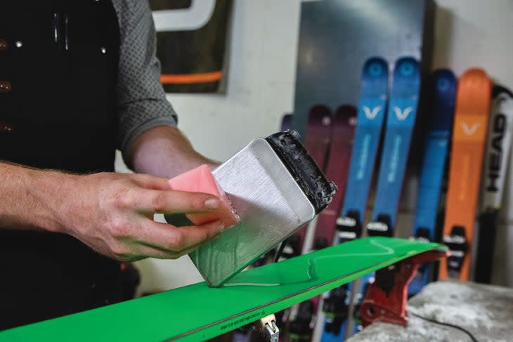 Wax being applied to skis