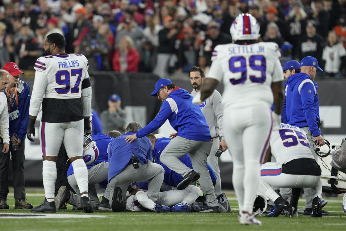 Buffalo Bills’ Damar Hamlin is examined during the first half of an NFL football game against the Cincinnati Bengals, Monday, Jan. 2, 2023, in Cincinnati. (AP Photo/Jeff Dean)