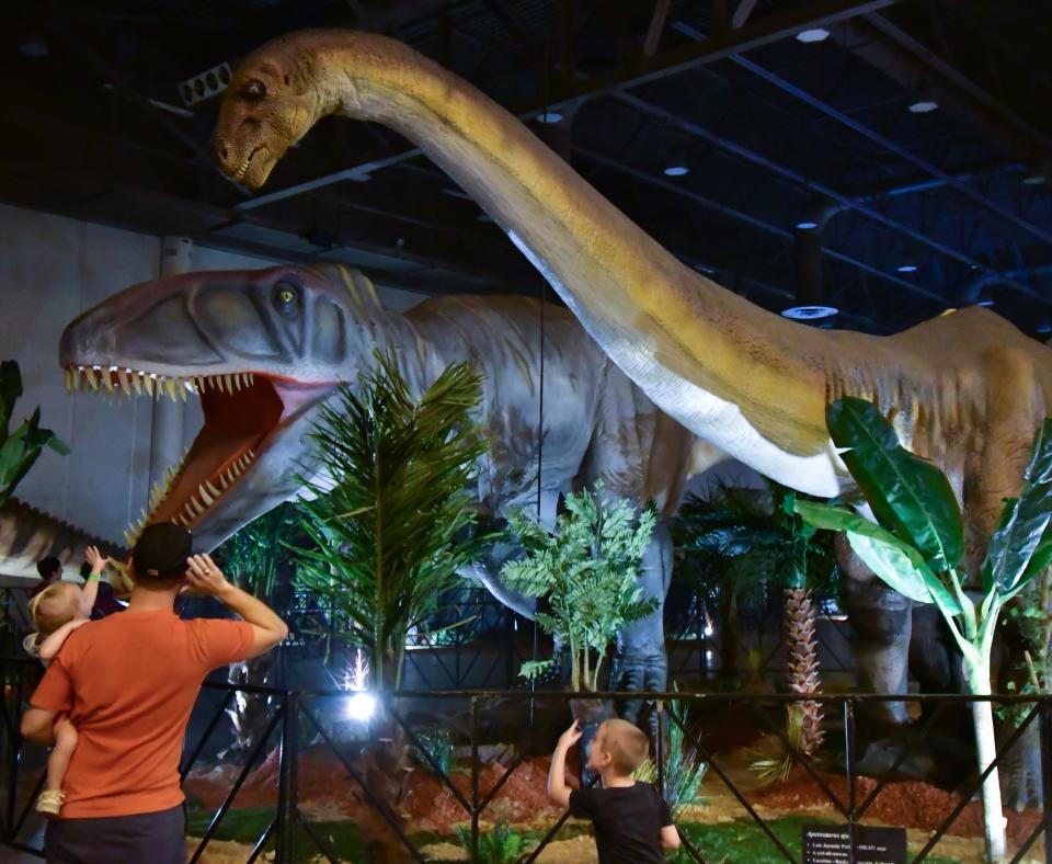 The Jurassic Quest tour features moving, roaring, realistic-looking dinosaurs.