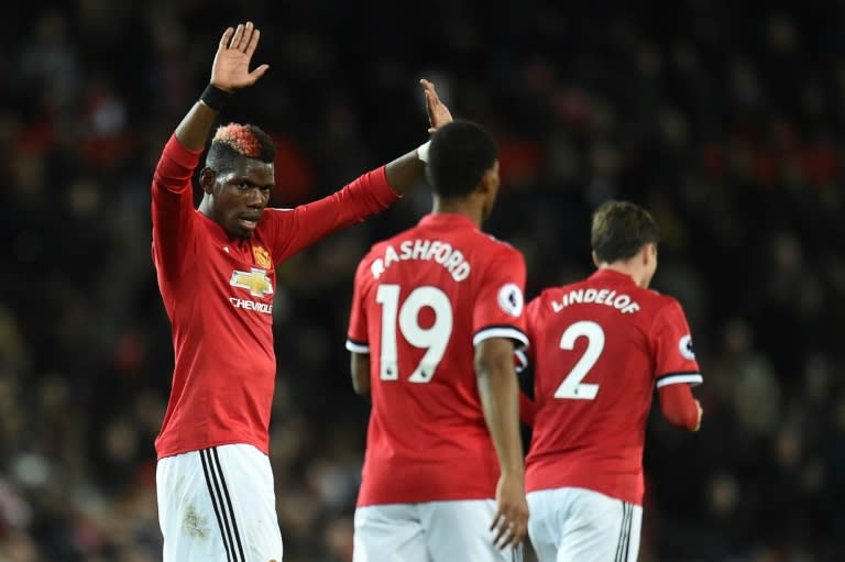 Manchester United's midfielder Paul Pogba (L) celebrates scoring on November 18, 2017